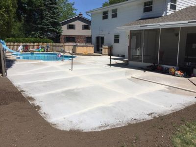 large concrete patio with pool